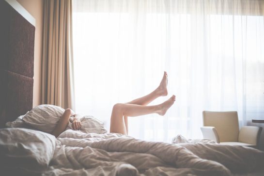 Beautiful Woman Enjoying Morning Relax in Bed