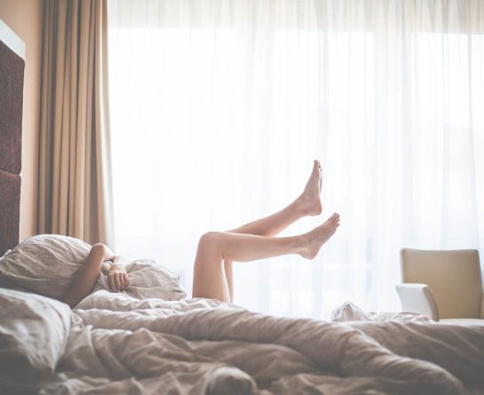 Beautiful Woman Enjoying Morning Relax in Bed